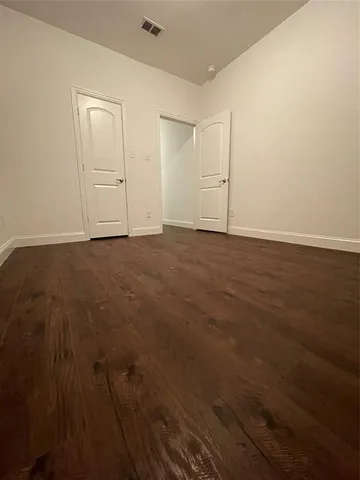 a view of a backyard with a garden and entertaining space