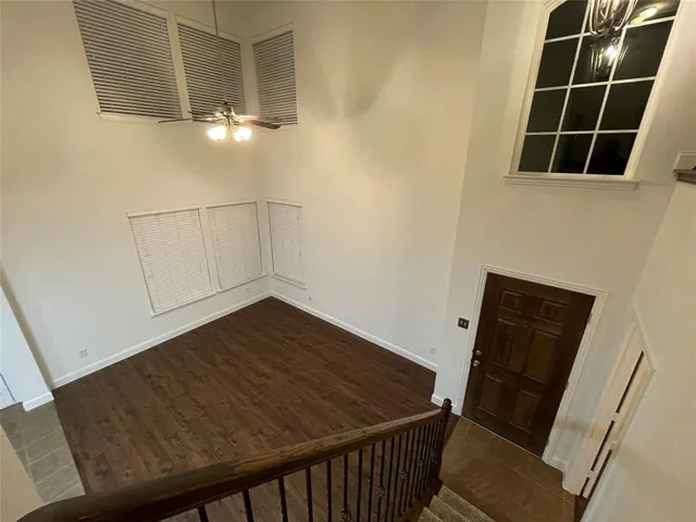 a view of storage and utility room with wooden floor