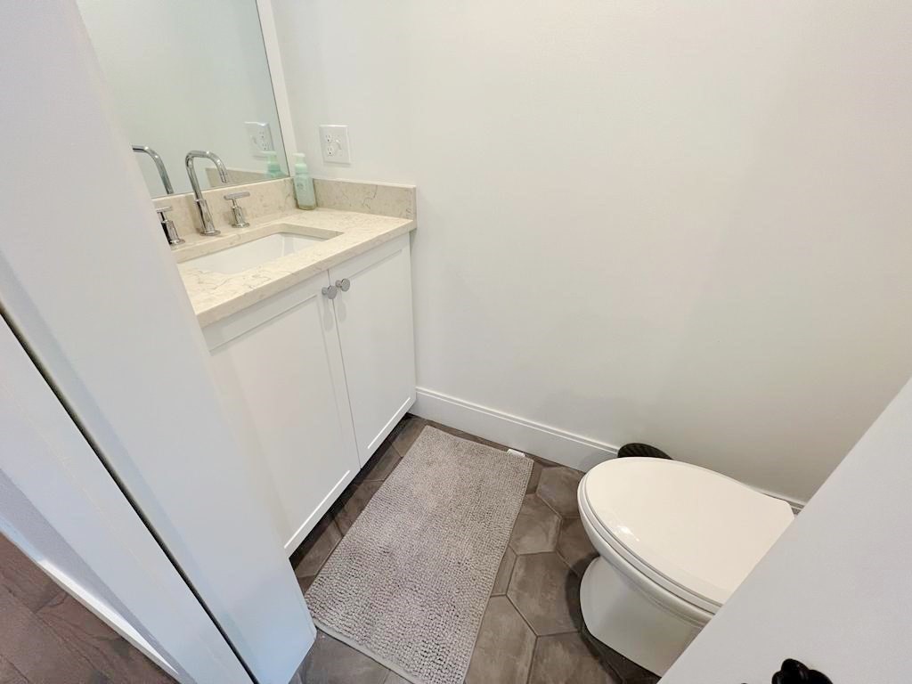 23 Charles Park Road, Unit 23 Boston, MA 02132 - Photo 12 of 35 a bathroom with a sink and a vanity