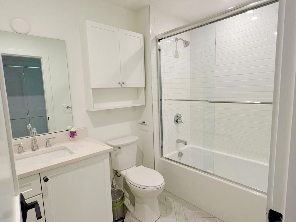 23 Charles Park Road, Unit 23 Boston, MA 02132 - Photo 23 of 35 a bathroom with a sink toilet and shower