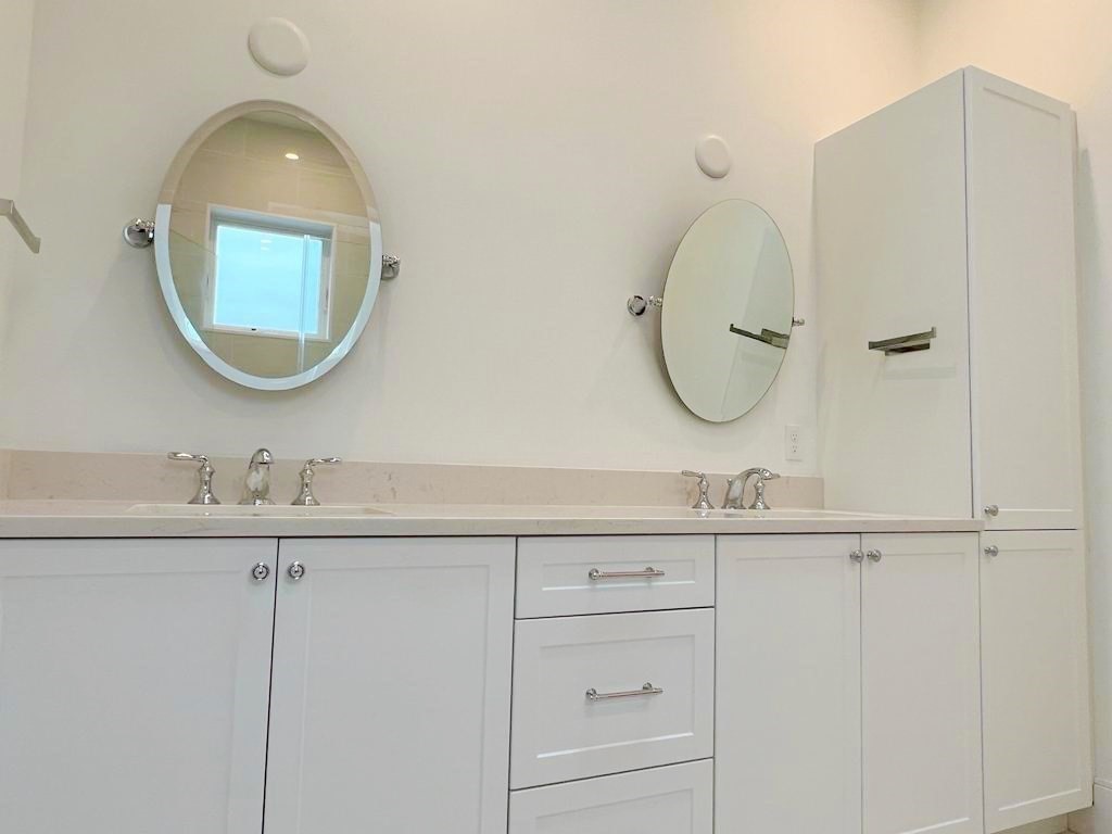 23 Charles Park Road, Unit 23 Boston, MA 02132 - Photo 27 of 35 a bathroom with a sink and a mirror