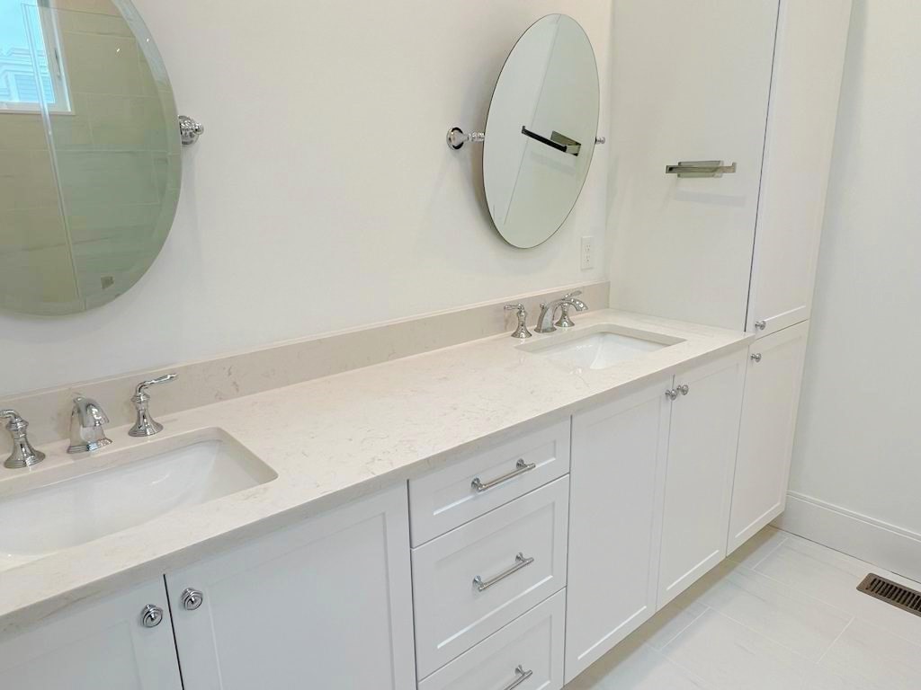 23 Charles Park Road, Unit 23 Boston, MA 02132 - Photo 28 of 35 a bathroom with a double vanity sink and mirror