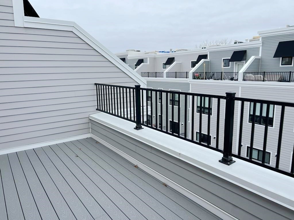 23 Charles Park Road, Unit 23 Boston, MA 02132 - Photo 33 of 35 a view of balcony with wooden floor