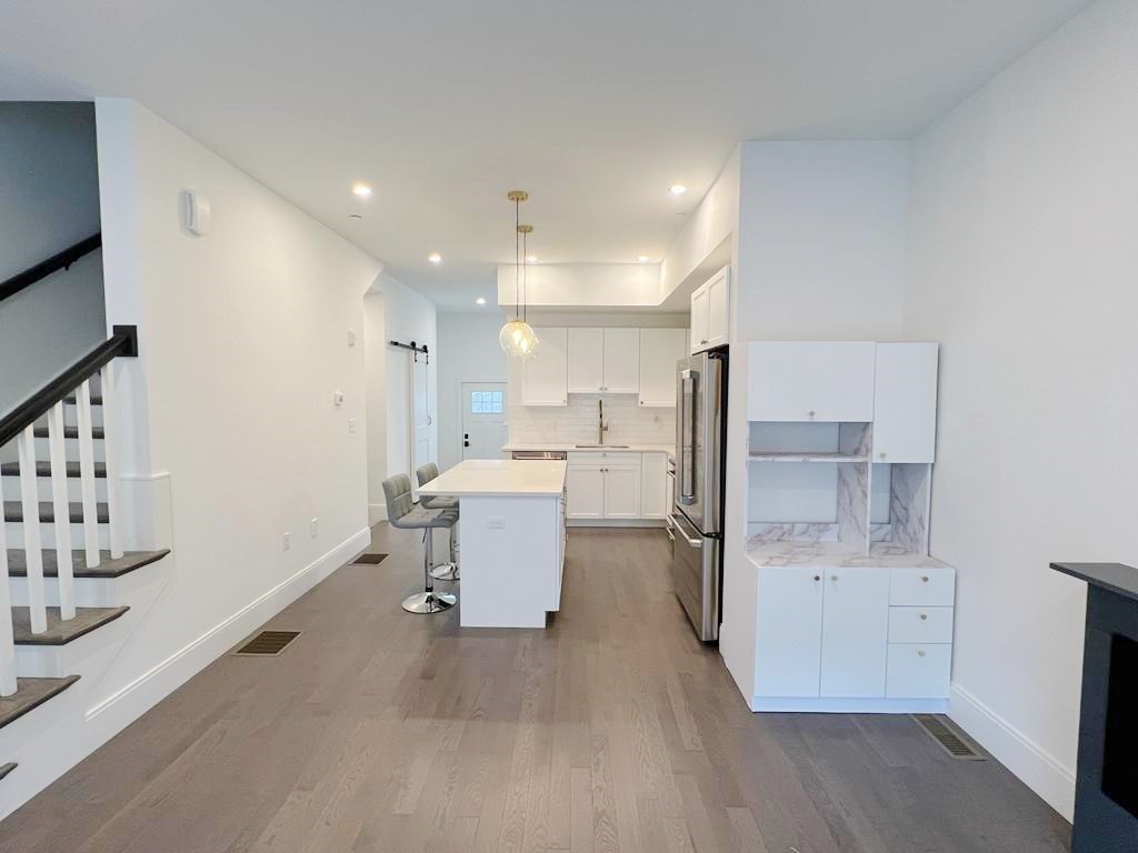 23 Charles Park Road, Unit 23 Boston, MA 02132 - Photo 8 of 35 a kitchen with a sink appliances and cabinets