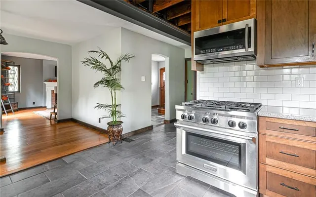 a kitchen with a stove and cabinets