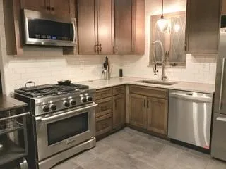 a kitchen with a stove and a sink