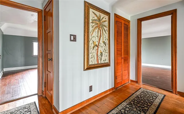 view of room with window and hallway