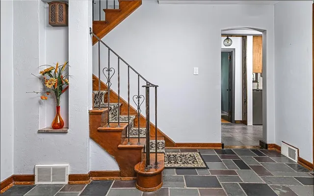 a view of entryway with a front door