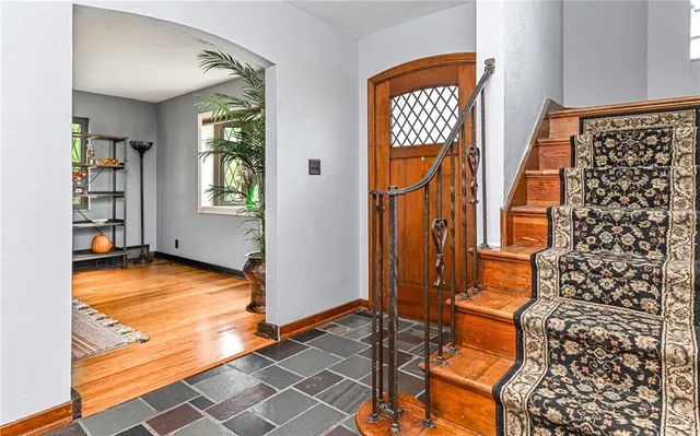 a view of an entryway with wooden floor and garden