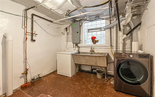 a utility room with dryer and washer