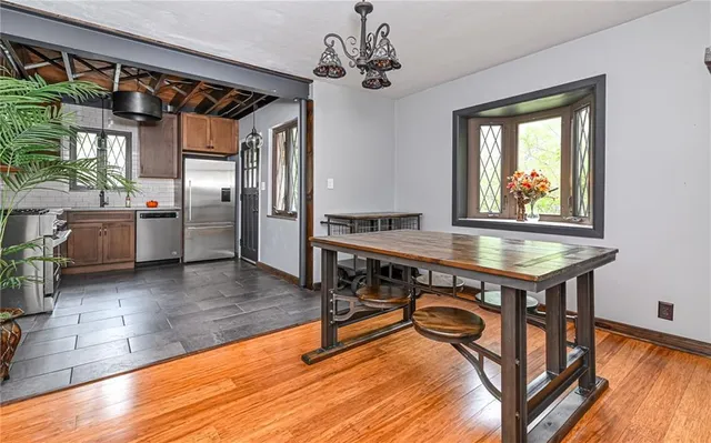 a room with pool table and windows
