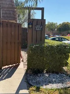 a couple of potted plants in front of door