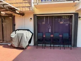 a view of two chairs in the room