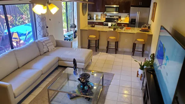 a living room with patio furniture