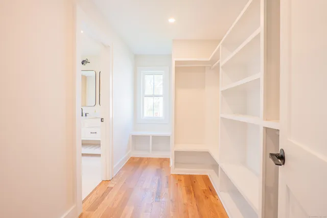 a view of bathroom with bathtub and wooden floor