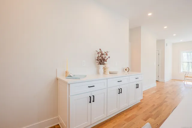 a spacious bathroom with a double vanity sink and mirror