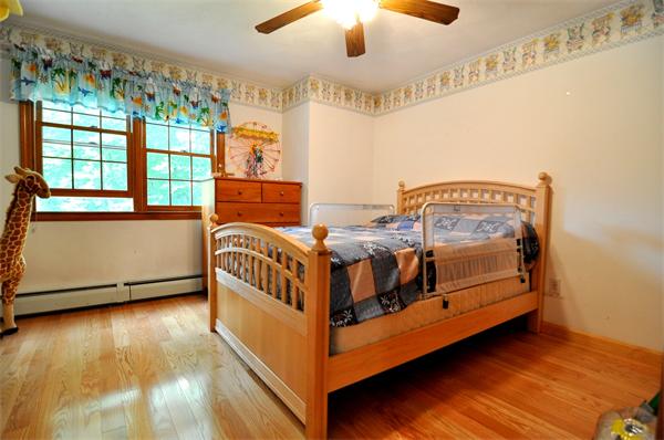 81 R Tenney Road Westford, MA 01886 - Photo 12 of 18 a bedroom with a bed and wooden floor
