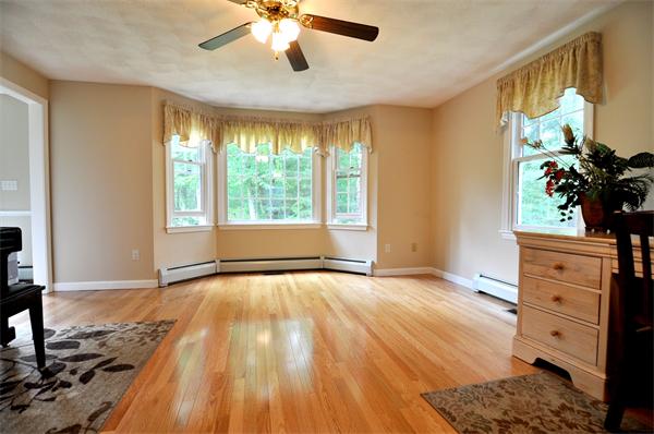 81 R Tenney Road Westford, MA 01886 - Photo 3 of 18 a view of an empty room with a window and wooden floor