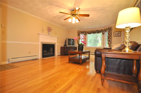 81 R Tenney Road Westford, MA 01886 - Photo 6 of 18 a living room with furniture and a fireplace