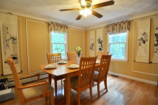 81 R Tenney Road Westford, MA 01886 - Photo 8 of 18 a view of a dining room with furniture window and wooden floor
