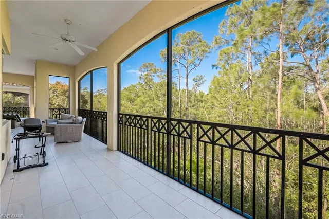 a view of a hallway with furniture