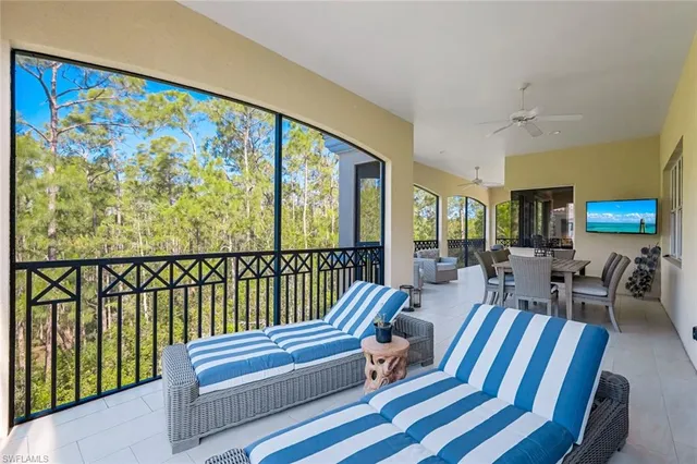a very nice looking living room with a large window
