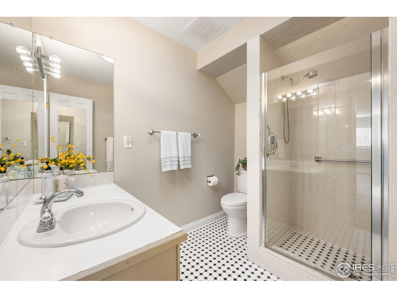 3074 Edison Court Boulder, CO 80301 - Photo 23 of 37 Primary bath with tile flooring, solar tube, shower walls and poured pan