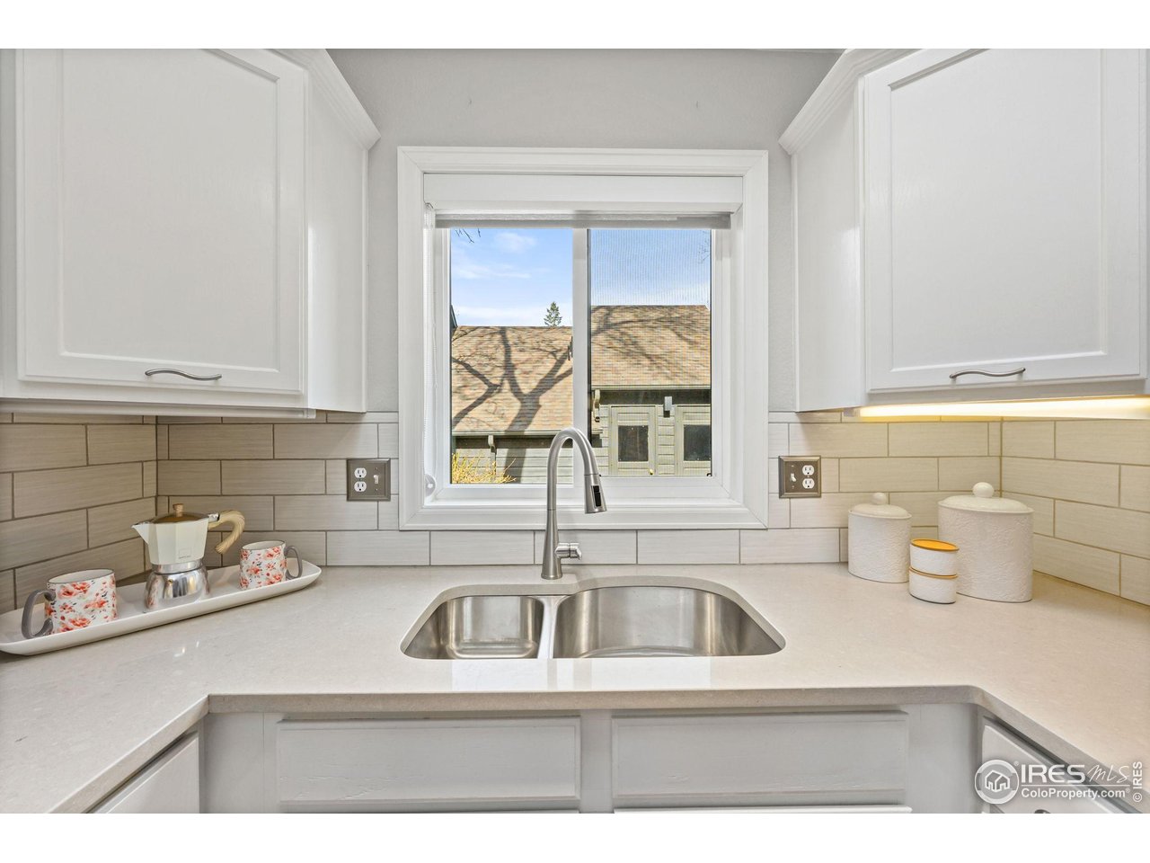 3074 Edison Court Boulder, CO 80301 - Photo 7 of 37 Upsized kitchen window over the undermount sink (that's the detached garage out there just a few steps away)