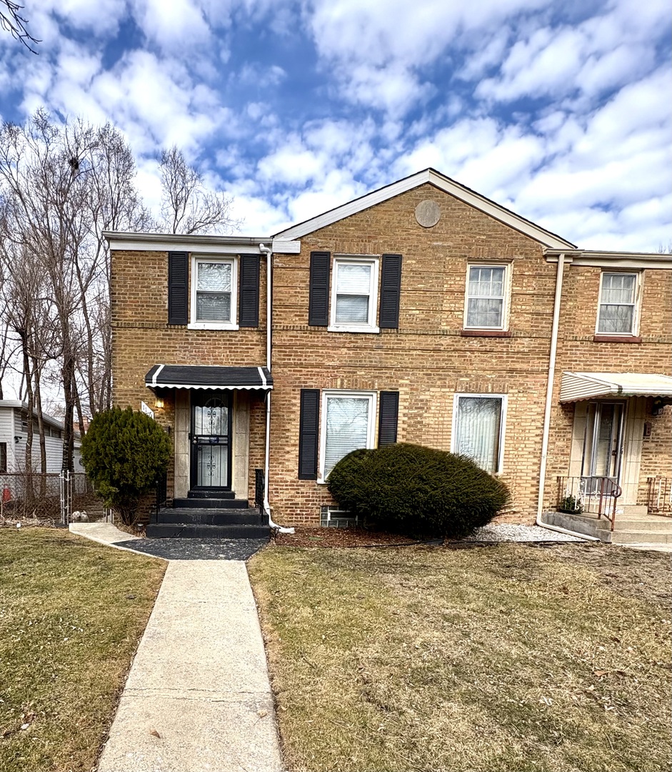 1116 West 111th Place Chicago, IL 60643 - Photo 1 of 3 a front view of a house with a yard