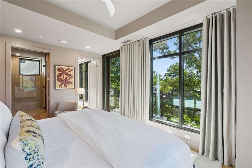 2520 Peachtree Road, Unit 603 Atlanta, GA 30305 - Photo 46 of 91 a bedroom with a large bed and a large window