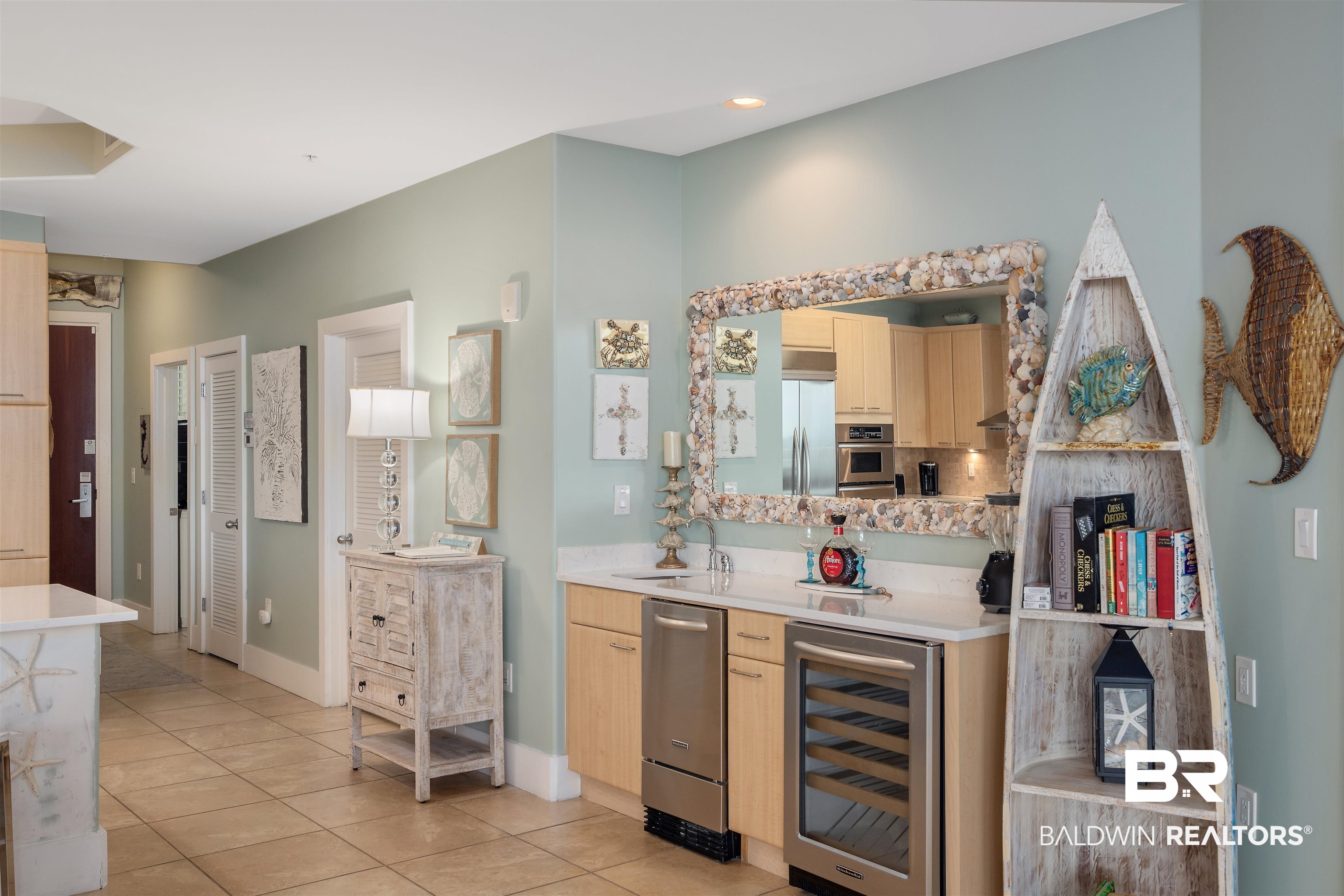 28107 Perdido Beach Boulevard, Unit DPH06 Orange Beach, AL 36561 - Photo 7 of 70 Interior space featuring light brown cabinets, appliances with stainless steel finishes, beverage cooler, and light tile patterned floors