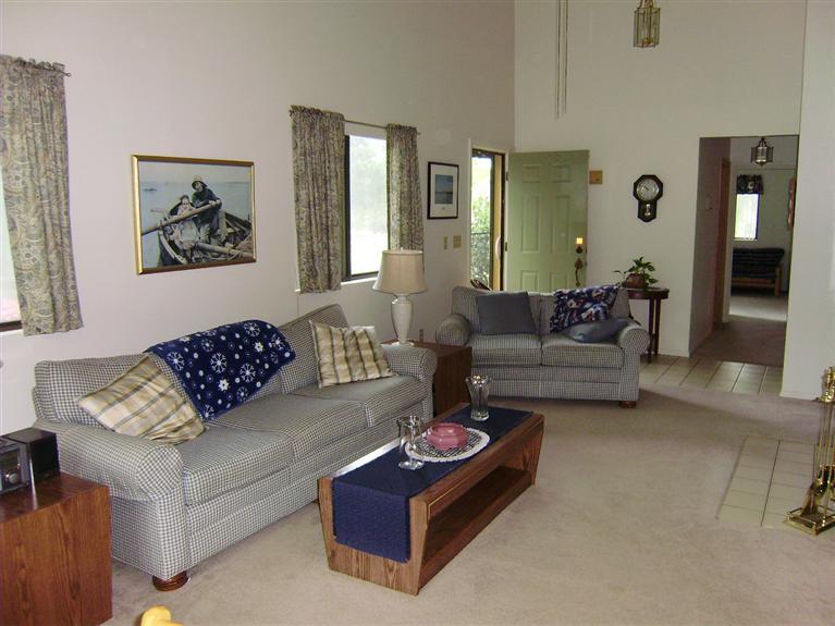37 Roundhouse Road, Unit 37 Buzzards Bay, MA 02532 - Photo 7 of 12 a living room with furniture and a couch