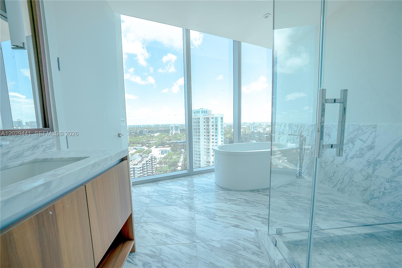 175 Southeast 25th Road, Unit 2103 Miami, FL 33129 - Photo 19 of 27 a large white kitchen with a large window