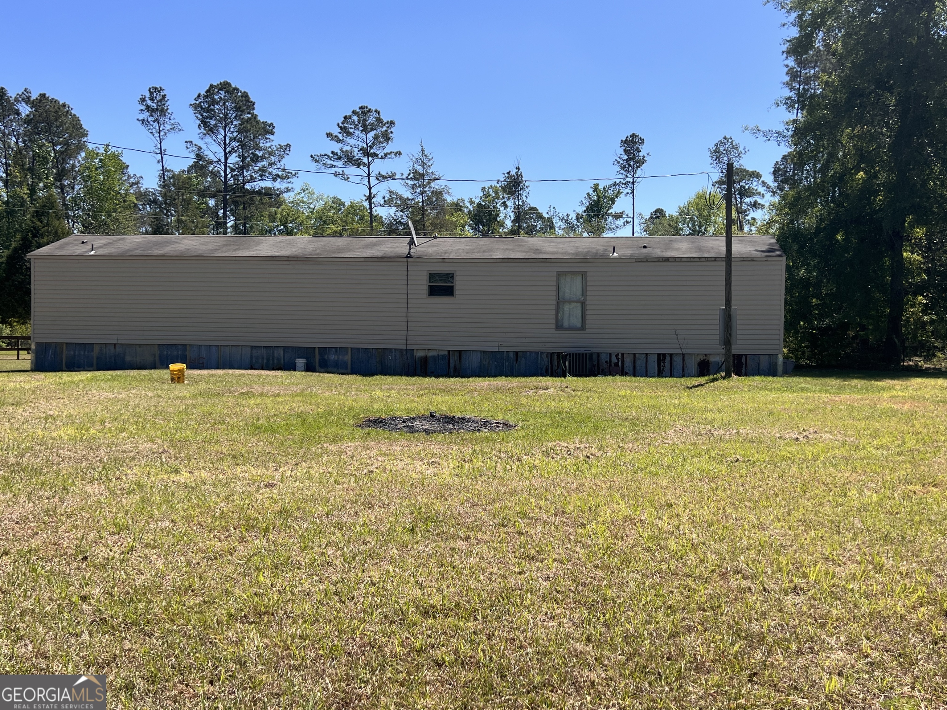 113 Riverview Soperton, GA 30457 - Photo 14 of 16 a view of swimming pool with an outdoor space and seating area