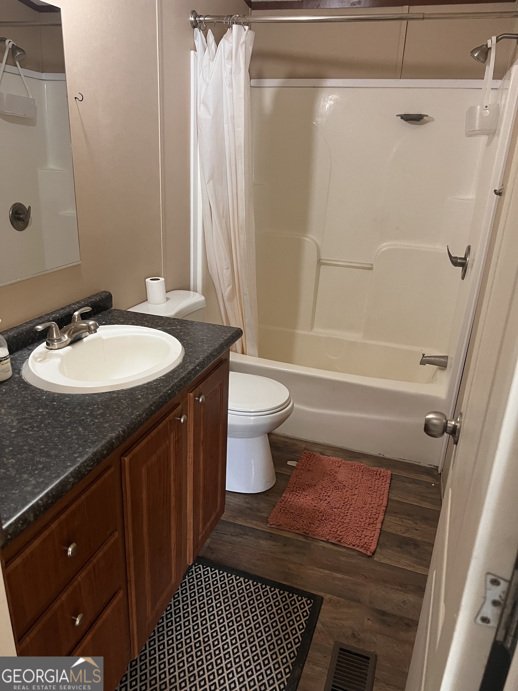 113 Riverview Soperton, GA 30457 - Photo 7 of 16 a bathroom with a sink a toilet and shower