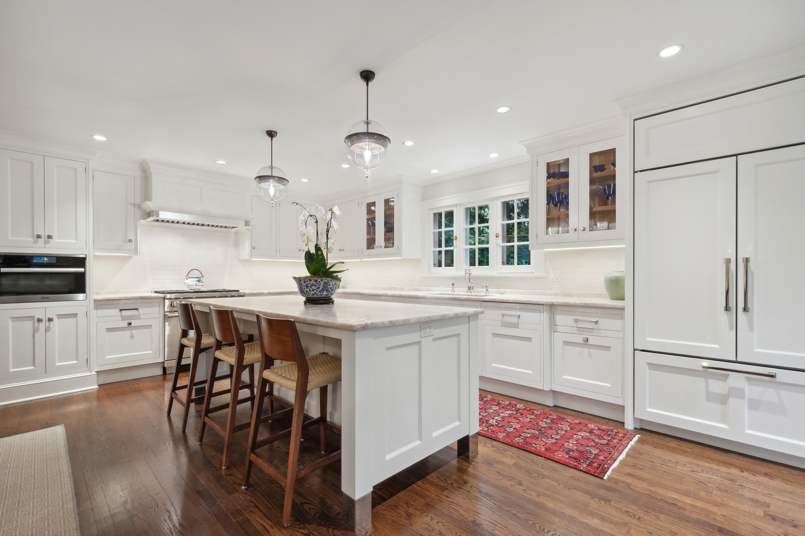 460 Washington Road Lake Forest, IL 60045 - Photo 12 of 50 a kitchen with white cabinets and stainless steel appliances
