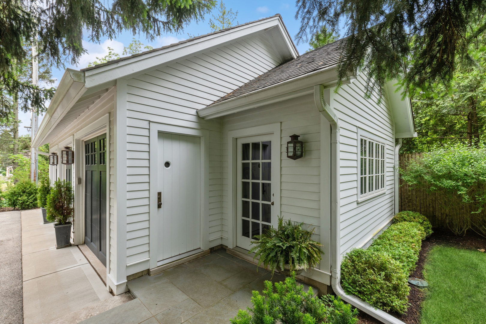 460 Washington Road Lake Forest, IL 60045 - Photo 39 of 50 a view of a house with a yard and potted plants