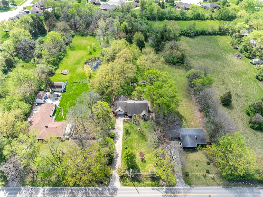 159 East Lytle 5 Points Road Springboro, OH 45066 - Photo 36 of 45 This expansive aerial view showcases a residential property surrounded by lush greenery and a tranquil pond.