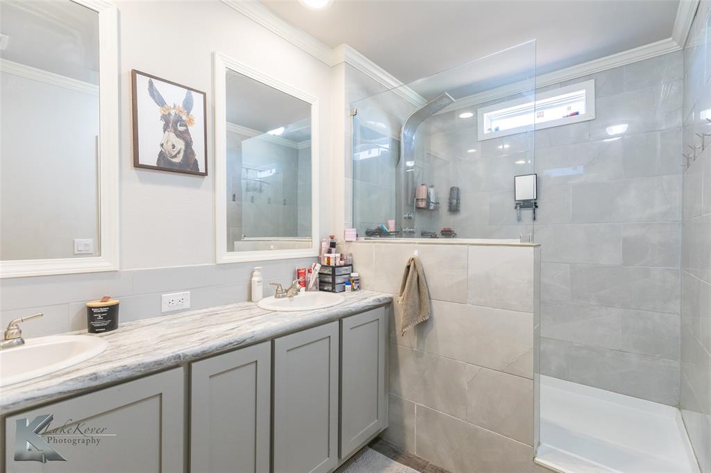 11682 County Road 434 Merkel, TX 79536 - Photo 14 of 37 a bathroom with a double vanity sink mirror and double
