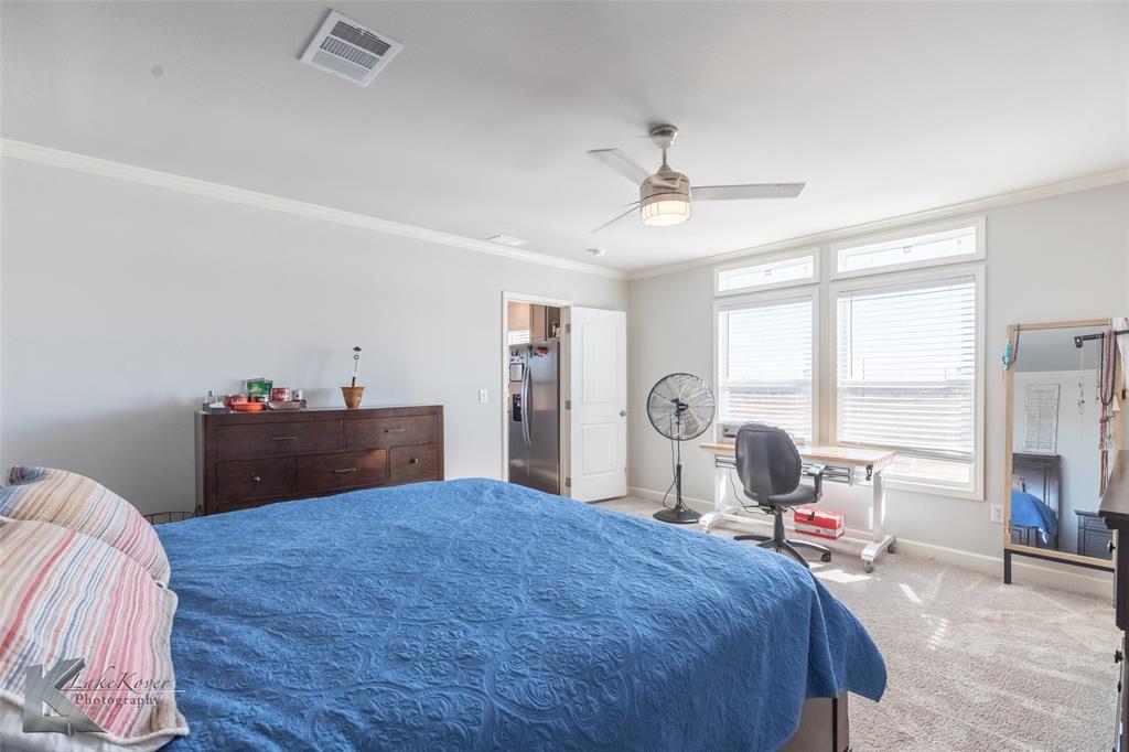 11682 County Road 434 Merkel, TX 79536 - Photo 15 of 37 a bed room with a bed and a large window