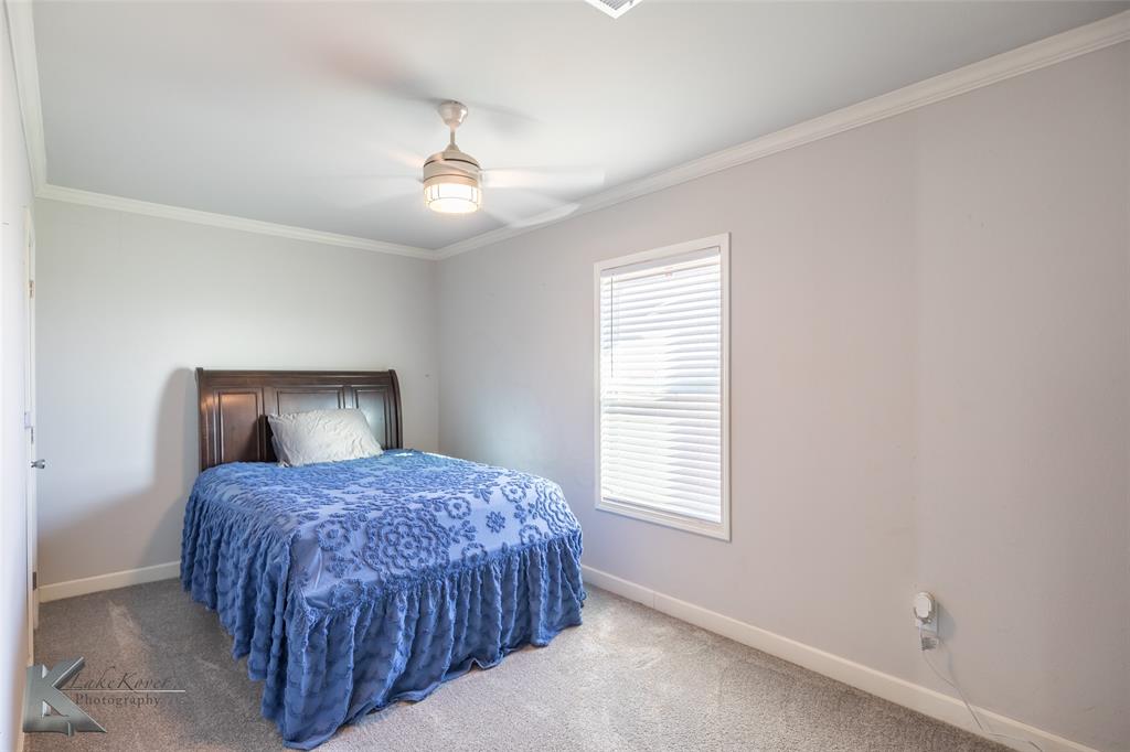11682 County Road 434 Merkel, TX 79536 - Photo 5 of 37 a bedroom with a large bed and a window