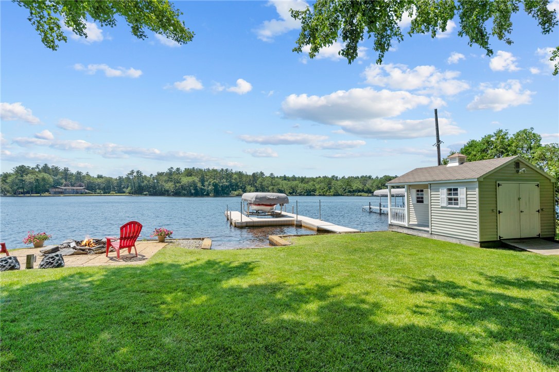 31 Sharon Drive Coventry, RI 02816 - Photo 13 of 49 Large flat yard with storage shed and outbuilding.