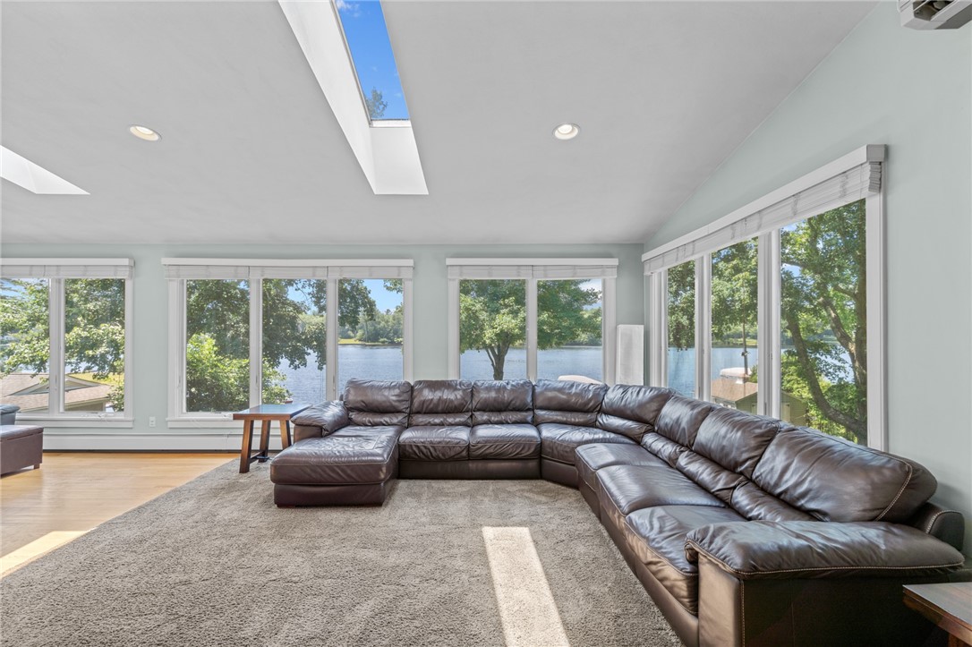 31 Sharon Drive Coventry, RI 02816 - Photo 16 of 49 Amazing great room with three walls of windows and separate half bath.