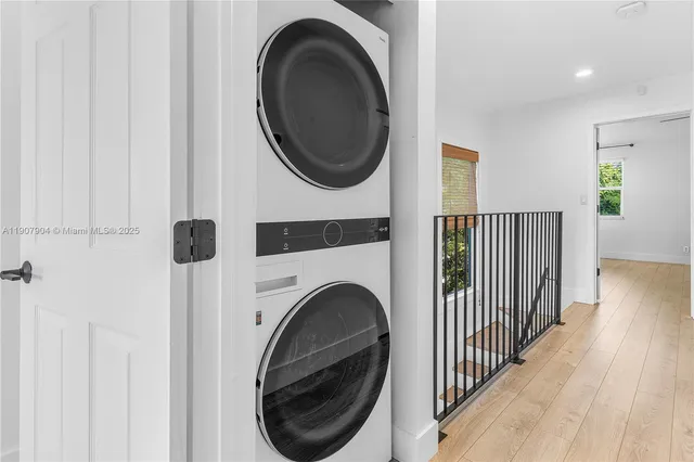 a view of a hallway with washer and dryer