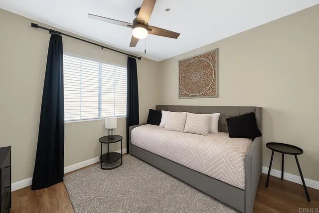 a bedroom with a bed and a table