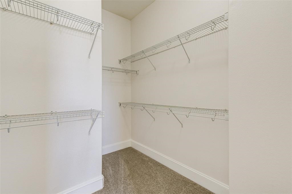 7134 Mapleridge Street, Unit 3B Houston, TX 77081 - Photo 16 of 26 a view of a room with racks on the wall