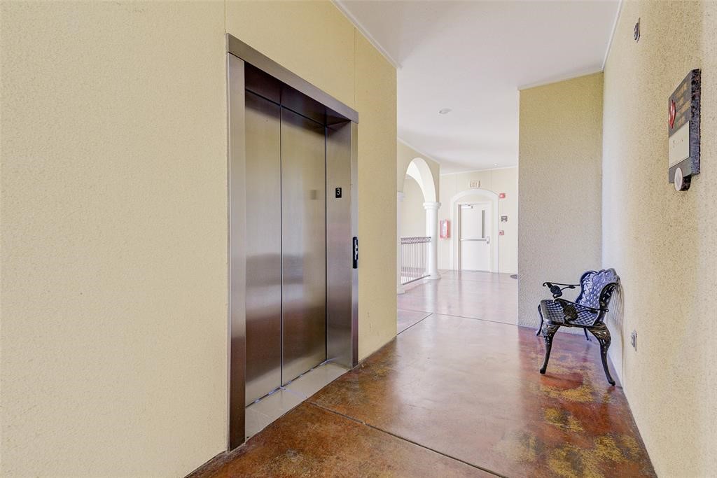 7134 Mapleridge Street, Unit 3B Houston, TX 77081 - Photo 4 of 26 a view of a hallway with wooden floor and glass door