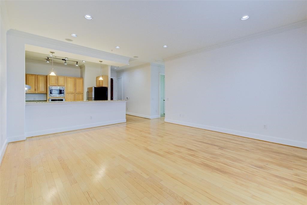 7134 Mapleridge Street, Unit 3B Houston, TX 77081 - Photo 9 of 26 a view of a livingroom with wooden floor