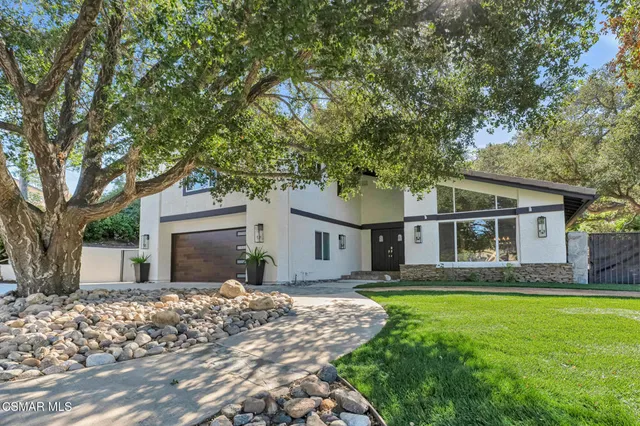 a view of entryway with stairs and wooden floor
