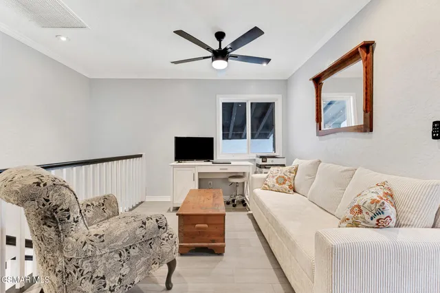 a view of backyard with outdoor seating and trees